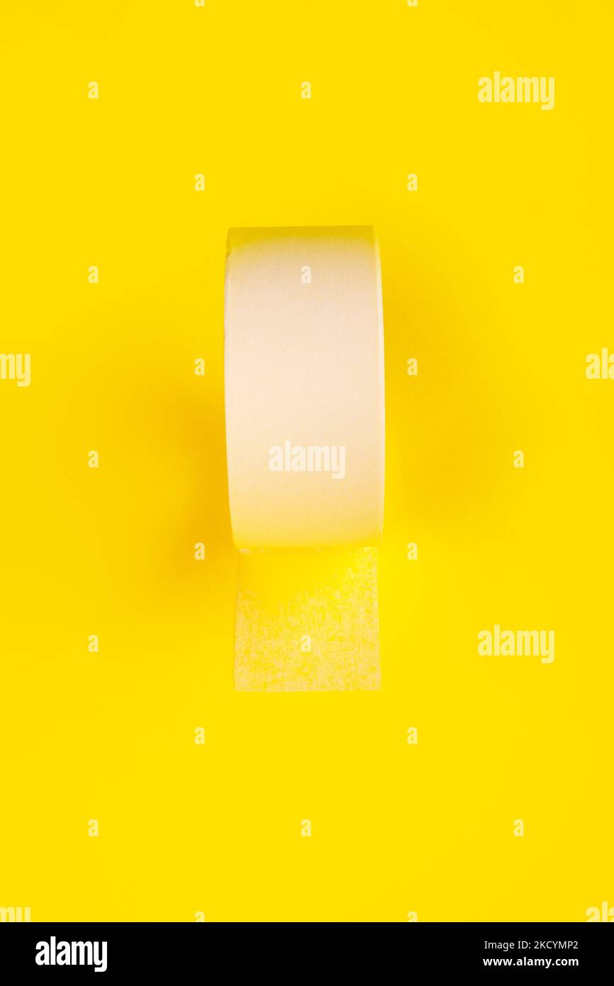 round adhesive sticky tape over yellow background Stock Photo Alamy