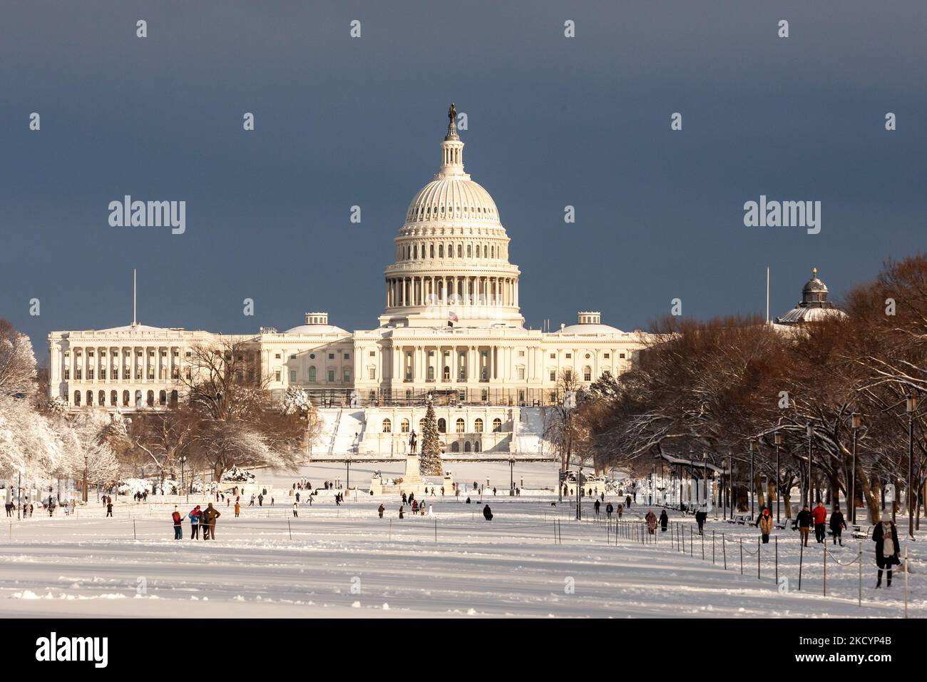 The sun shines on the US Capitol after an unexpected snowstorm dumped ...