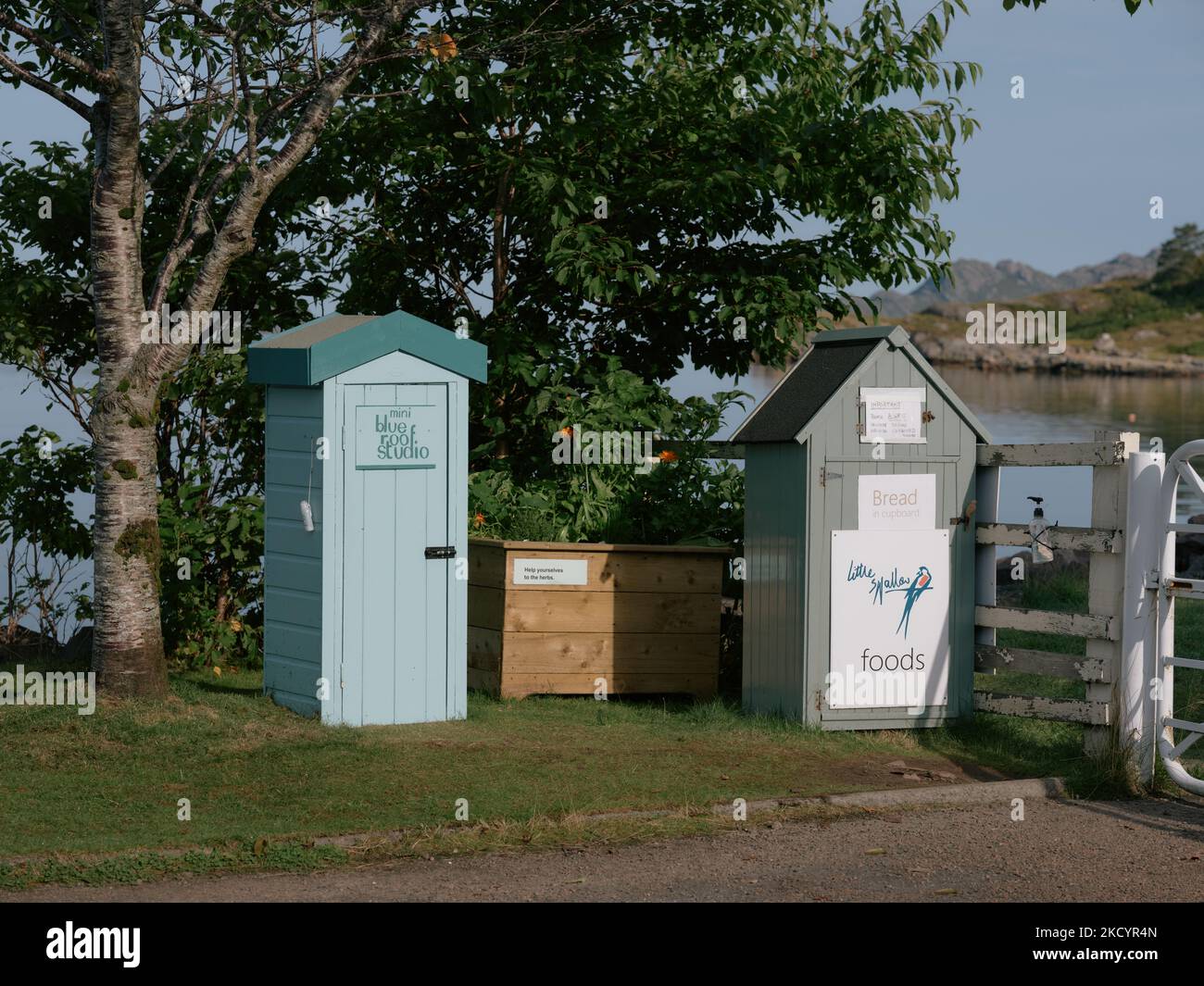 Honesty boxes in Shieldaig village high street in Wester Ross, Highland, Scotland UK local