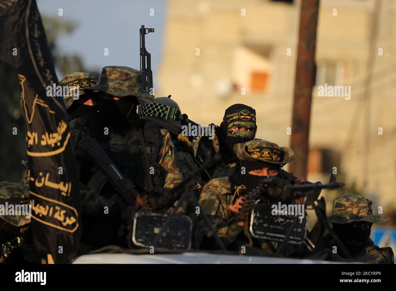 Palestinian members of the Al-Quds Brigades, the military wing of the Islamic Jihad group, march with their rifles along the main road of Gaza Strip, take part in a military parade to celebrate after â€‹a Palestinian prisoner Hisham Abu Hawash who ended his hunger strike after Israel committed to his eventual release, on January 5, 2022. (Photo by Majdi Fathi/NurPhoto) Stock Photo