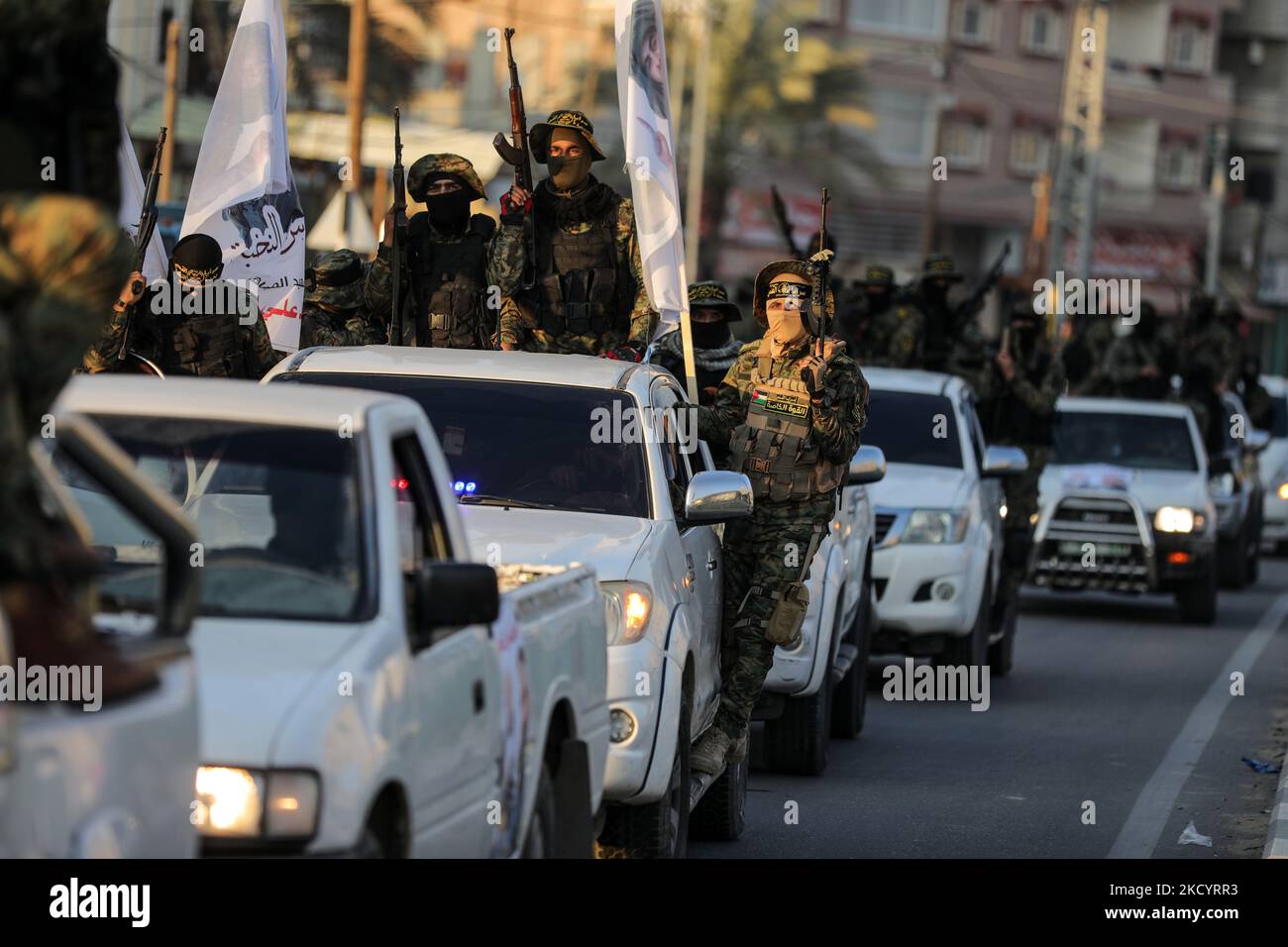 Palestinian members of the Al-Quds Brigades, the military wing of the Islamic Jihad group, march with their rifles along the main road of Gaza Strip, take part in a military parade to celebrate after â€‹a Palestinian prisoner Hisham Abu Hawash who ended his hunger strike after Israel committed to his eventual release, on January 5, 2022. (Photo by Majdi Fathi/NurPhoto) Stock Photo