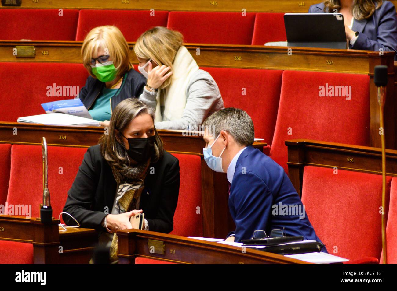 Two deputies talking with each other. Public session at the National ...