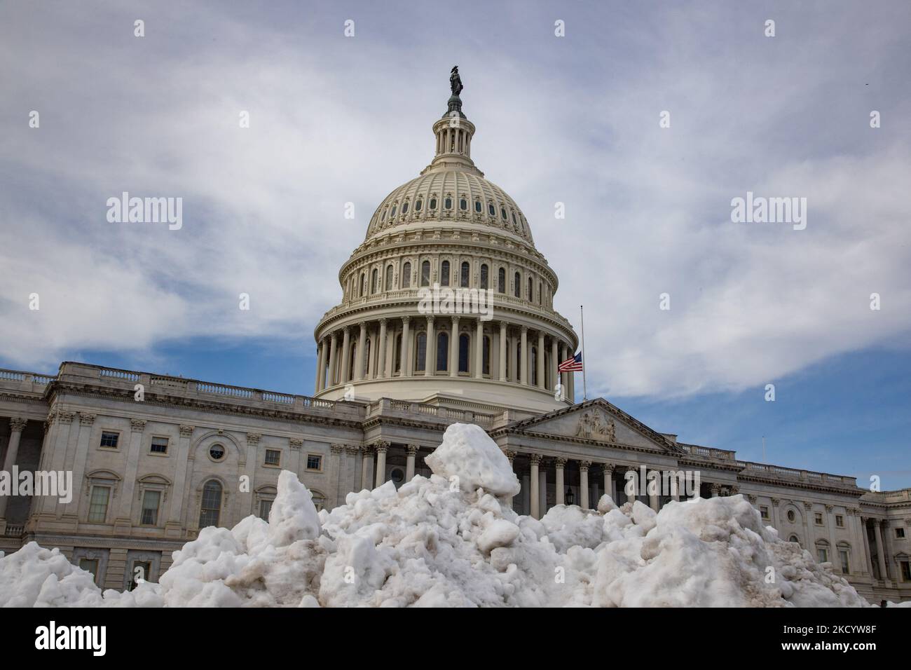 The U.S. Capitol is seen behind a pile of snow on January 6, 2022, the