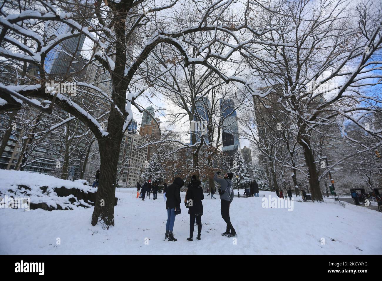 Peolple plays with snow in Central Park, Manhattan, NYC on January 7th