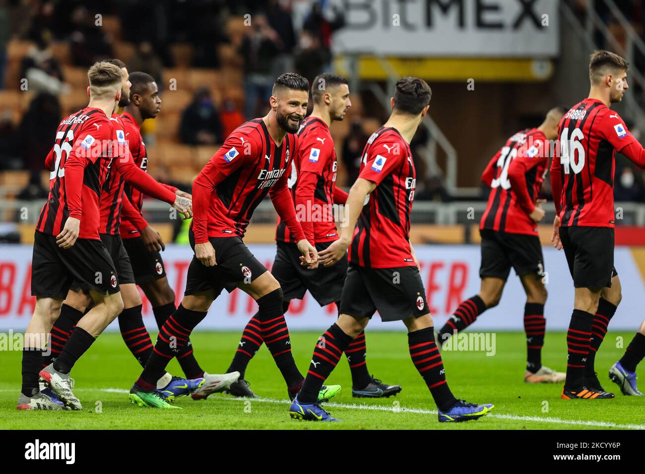 Olivier Giroud of AC Milan celebrates with his team mates after scoring a goal during the Serie A 2021/22 football match between AC Milan and AS Roma at Giuseppe Meazza Stadium, Milan, Italy on January 06, 2022 (Photo by Fabrizio Carabelli/LiveMedia/NurPhoto) Stock Photo