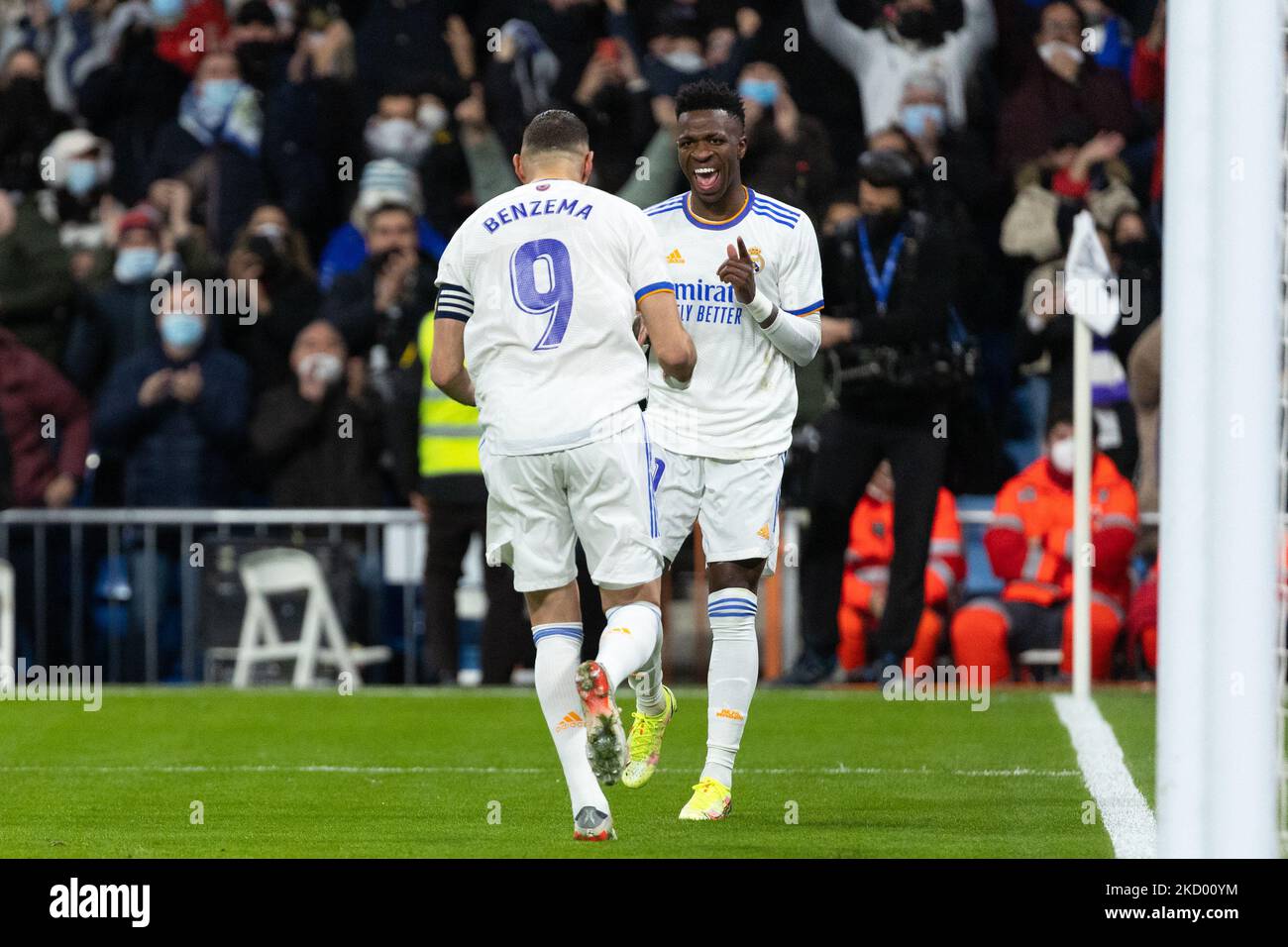 Vinicius Junior of Real Madrid celebrates a goal with Karim Benzema of