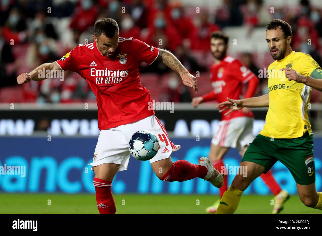 Haris Seferovic of SL Benfica(L) vies with Marco Baixinho of FC Pacos Ferreira during the Portuguese League football match between SL Benfica and FC Pacos Ferreira at the Luz stadium in Lisbon, Portugal on January 9, 2022. (Photo by Pedro FiÃºza/NurPhoto) Stock Photo
