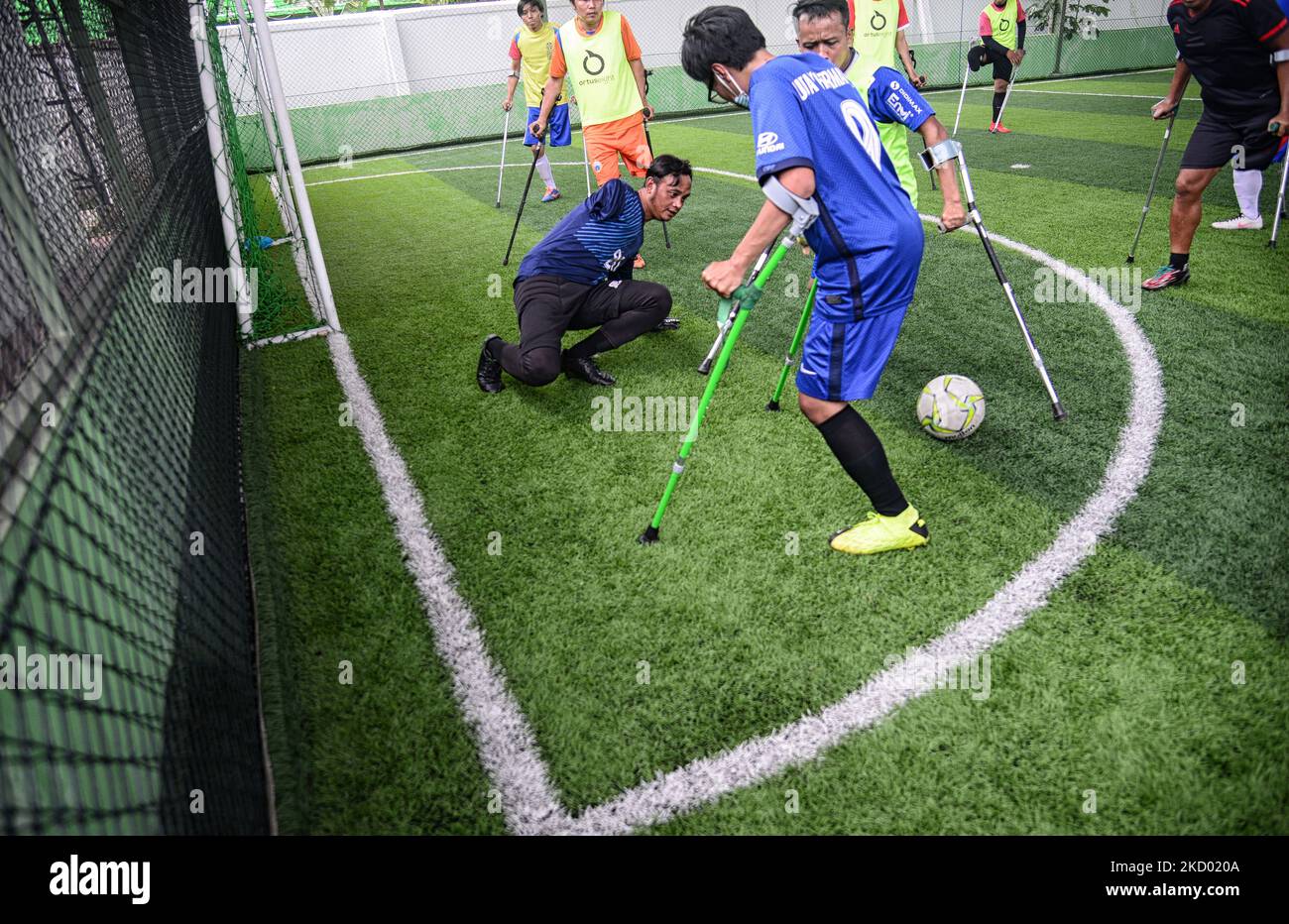 Players of Asprov West Java amputees football team using crutches play