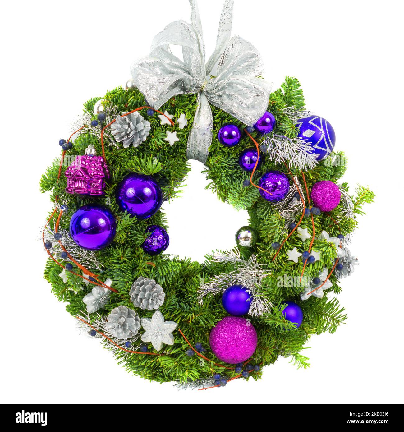 Christmas wreath isolated on white background, top view of New Year composition with blue and purple ornaments. Christmas decoration made of natural g Stock Photo