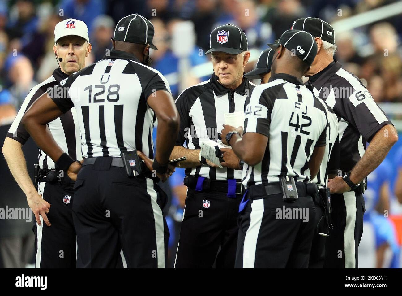 Officials including umpire Ramon George (128), field judge Nate Jones (42), down judge Derick Bowers (74), back judge Terrence Miles (111), line judge Walt Coleman IV (65), and side judge Gary Cavaletto (60) gather to discuss between plays during an NFL football game between the Detroit Lions and the Green Bay Packers in Detroit, Michigan USA, on Sunday, January 9, 2022. (Photo by Amy Lemus/NurPhoto) Stock Photo