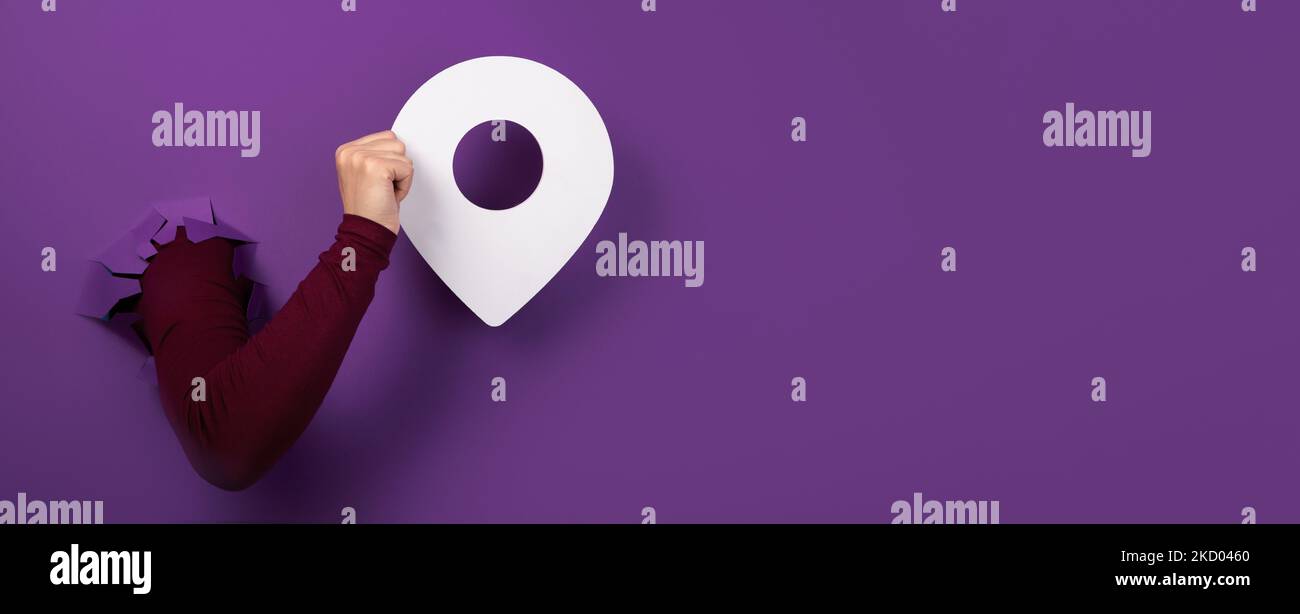 Pin Over hand holding pin over purple background, panoramic layout Stock Photo ...