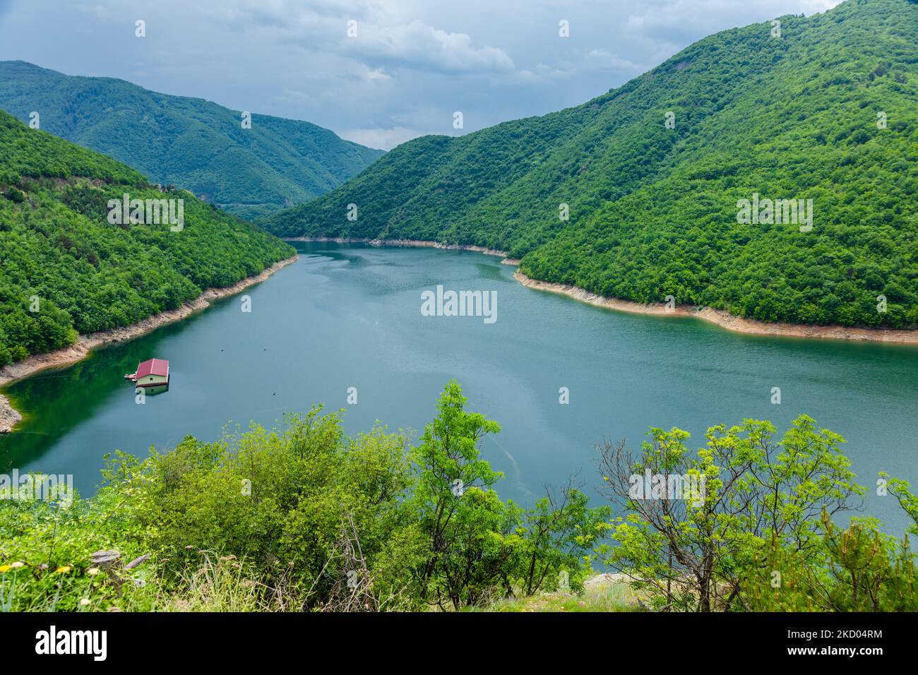 aerial view of green mountains, clouds and river Stock Photo - Alamy