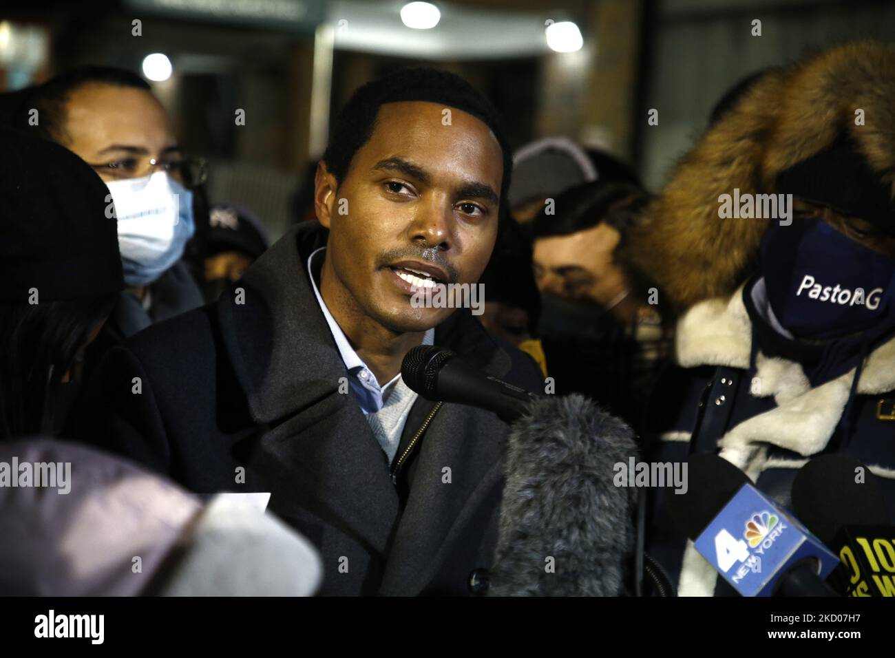 US Representative Ritchie Torres speaks during a vigil in front of a hi