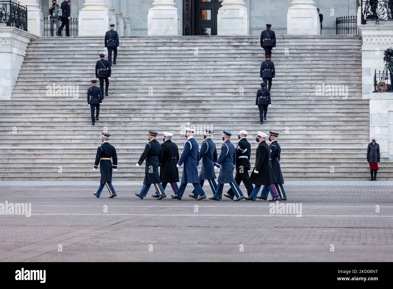 A military honor guard walks in formation after placing the remains of Harry Reid in a waiting hearse for departure from the Capitol, after lying in state in the rotunda. Reid was a Nevada Democrat who served in the House of Representatives from 1983-1987. He was a Senator from 1987-2017, and alternately served as Senate Majority and Minority Leader from 2005-2017. (Photo by Allison Bailey/NurPhoto) Stock Photo