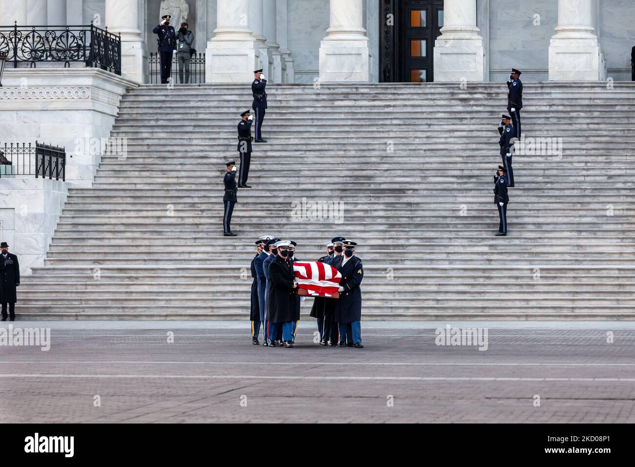 A military honor guard carries the remains of Harry Reid out of the Capitol, after lying in state in the rotunda. A Capitol Police honor guard salutes on the east front center steps. Reid was a Nevada Democrat who served in the House of Representatives from 1983-1987. He was a Senator from 1987-2017, and alternately served as Senate Majority and Minority Leader from 2005-2017. (Photo by Allison Bailey/NurPhoto) Stock Photo