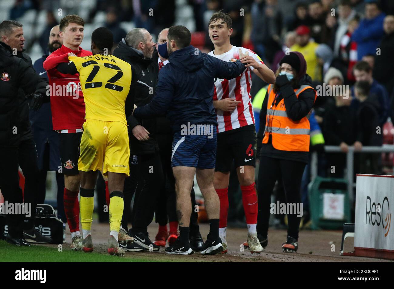 Callum Doyle of Sunderland interacts with TJ Eyoma of Lincoln City during the Sky Bet League 1 match between Sunderland and Lincoln City at the Stadium Of Light, Sunderland on Tuesday 11th January 2022. (Photo by Will Matthews /MI News/NurPhoto) Stock Photo