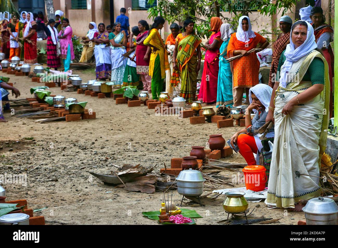 Hindu Women Wait For The Signal To Begin Cooking Pongala Along During hindu-women-wait-for-the-signal-to-begin-cooking-pongala-along-during