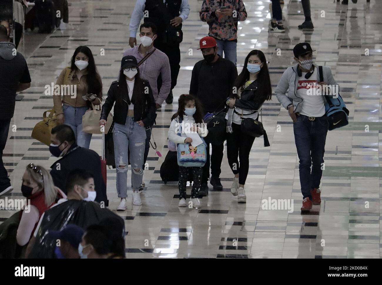 A group of people inside Terminal 1 of Mexico City International Airport during the health emergency and the green epidemiological traffic light in the capital. (Photo by Gerardo Vieyra/NurPhoto) Stock Photo