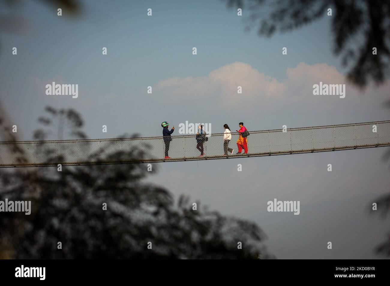 November 5, 2022, Kathmandu, Bagmati, Nepal: People take photos on a suspension bridge in Kirtipur, outskirts of Kathmandu, Nepal on November 5, 2022. (Credit Image: ©  Sunil Sharma/ZUMA Press Wire) Credit: ZUMA Press, Inc./Alamy Live News Stock Photo