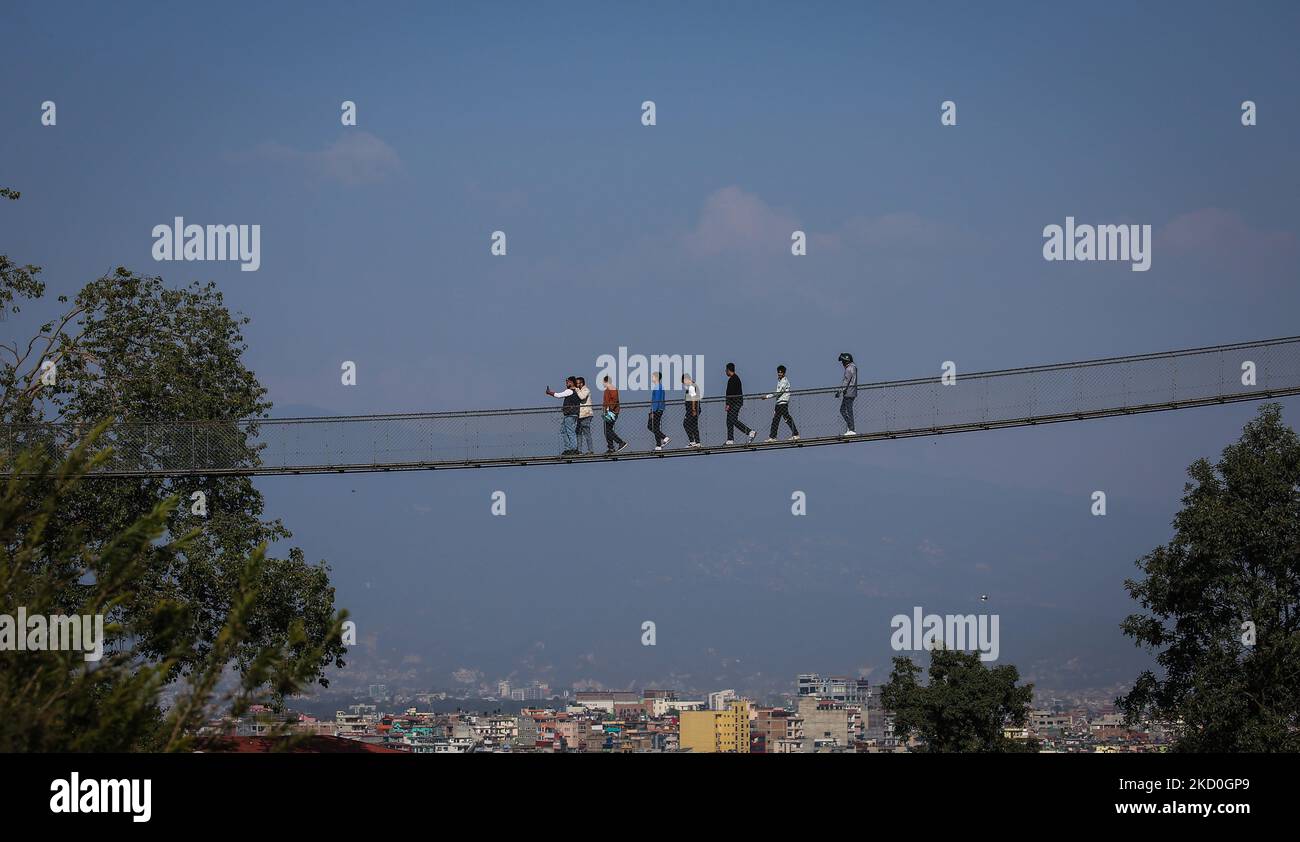 November 5, 2022, Kathmandu, Bagmati, Nepal: People walk on a suspension bridge in Kirtipur, outskirts of Kathmandu, Nepal on November 5, 2022. (Credit Image: ©  Sunil Sharma/ZUMA Press Wire) Credit: ZUMA Press, Inc./Alamy Live News Stock Photo