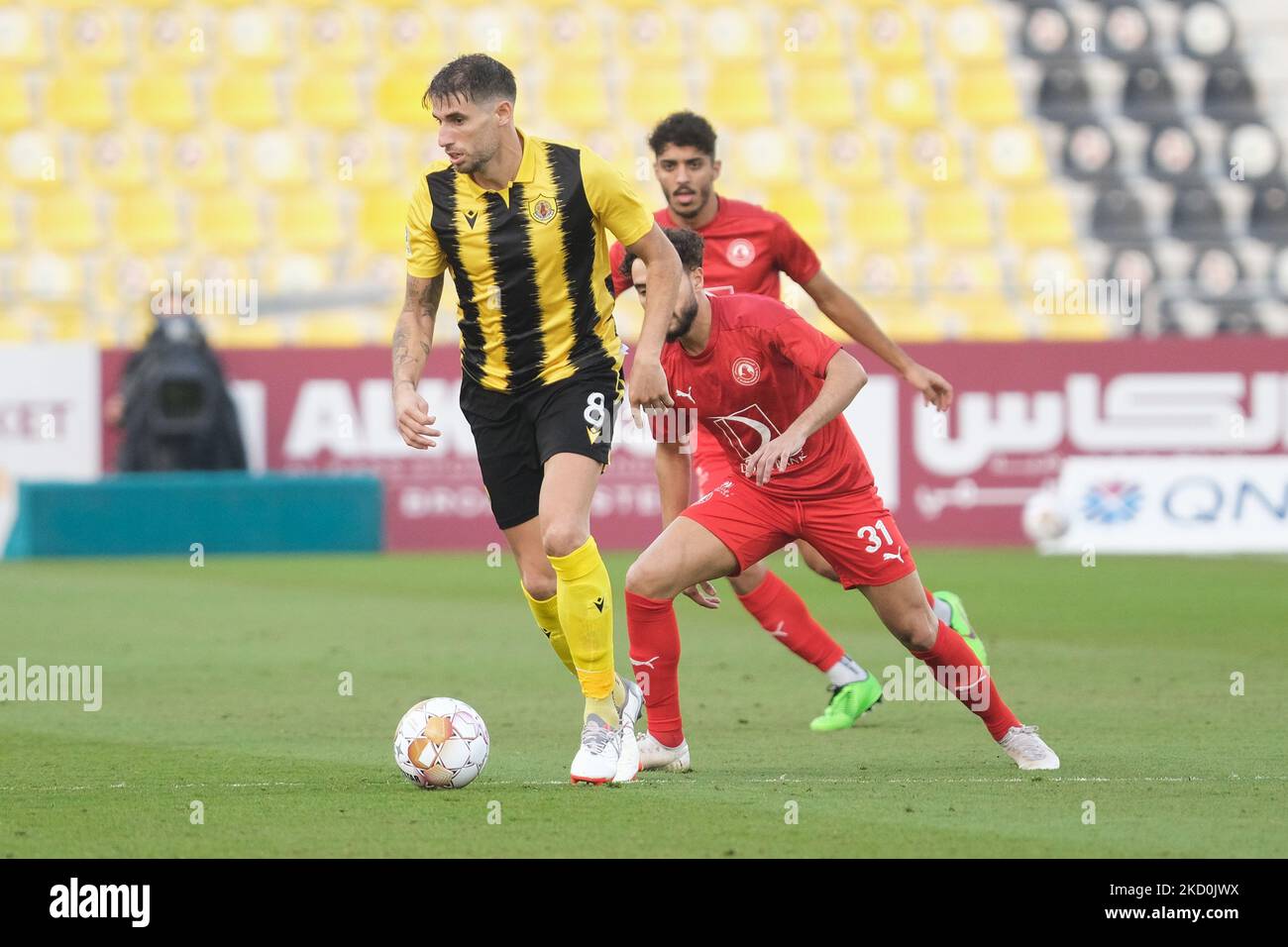 Javi Martinez (8) of Qatar SC on the ball during the QNB Stars League match between Al Arabi and Qatar SC at the Suheim Bin Hamad Stadium in Doha, Qatar on 17 of January 2022. (Photo by Simon Holmes/NurPhoto) Stock Photo