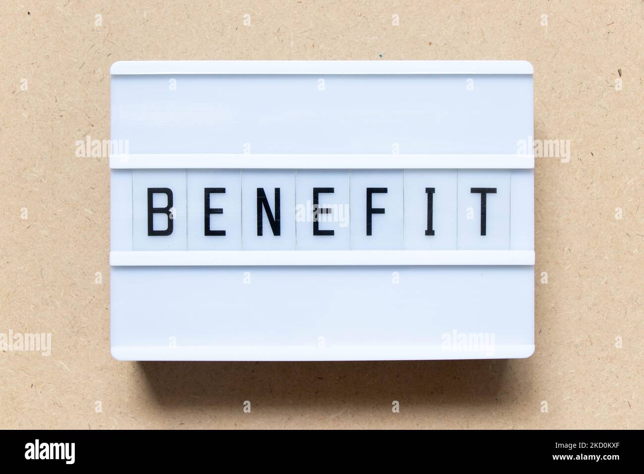 Lightbox with word benefit on wood background Stock Photo