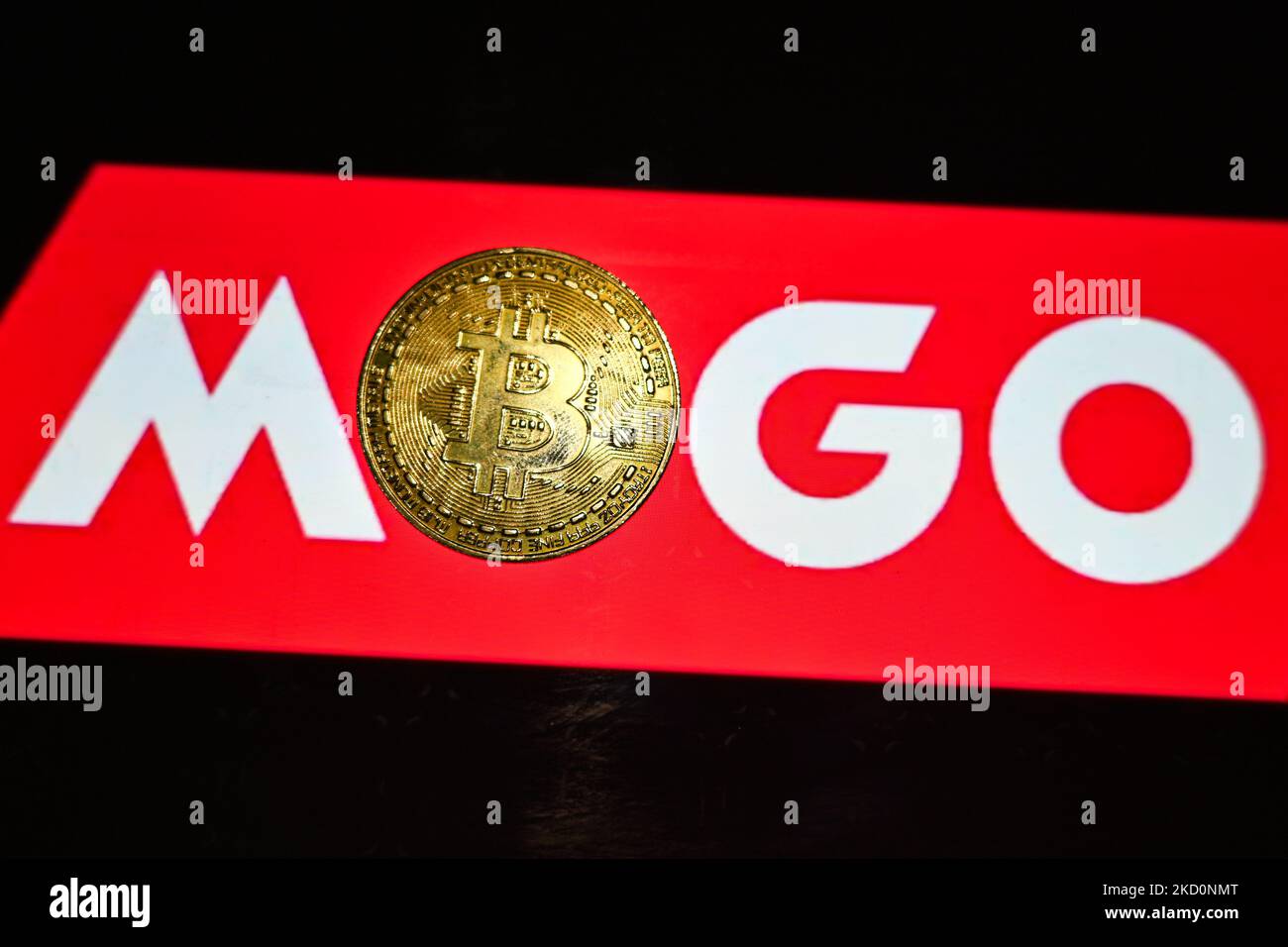 Illustrative image of a commemorative bitcoin with the MOGO logo seen in the background. On Wednesday, January 19, 2021, in Edmonton, Alberta, Canada. (Photo by Artur Widak/NurPhoto) Stock Photo