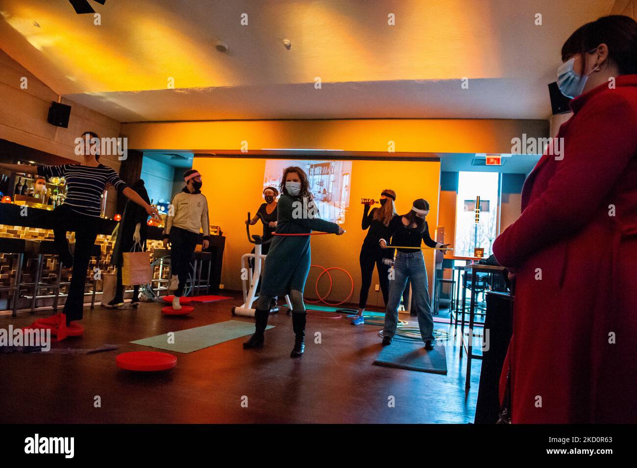 A group of workers of the LUX movie theater is exercising inside of the cinema, during the nationwide protest against the Dutch government's decision to not allow to open the culture sector yet. In Nijmegen, on January 19th, 2022. (Photo by Romy Arroyo Fernandez/NurPhoto) Stock Photo