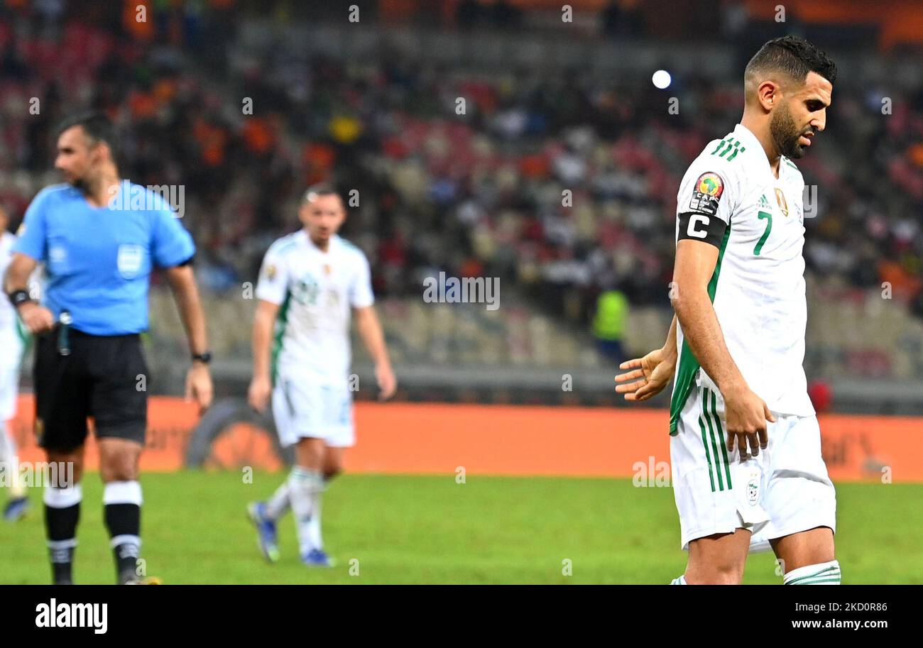 Algerian striker Riyad Mahrez (R) reacts after the match during the Africa Cup of Nations (CAN) 2021 Group E soccer match between Algeria and Equatorial Guinea at Stade de Japoma in Douala on January 16 2022 a in Douala on January 11, 2022 (Photo by APP/NurPhoto) Stock Photo