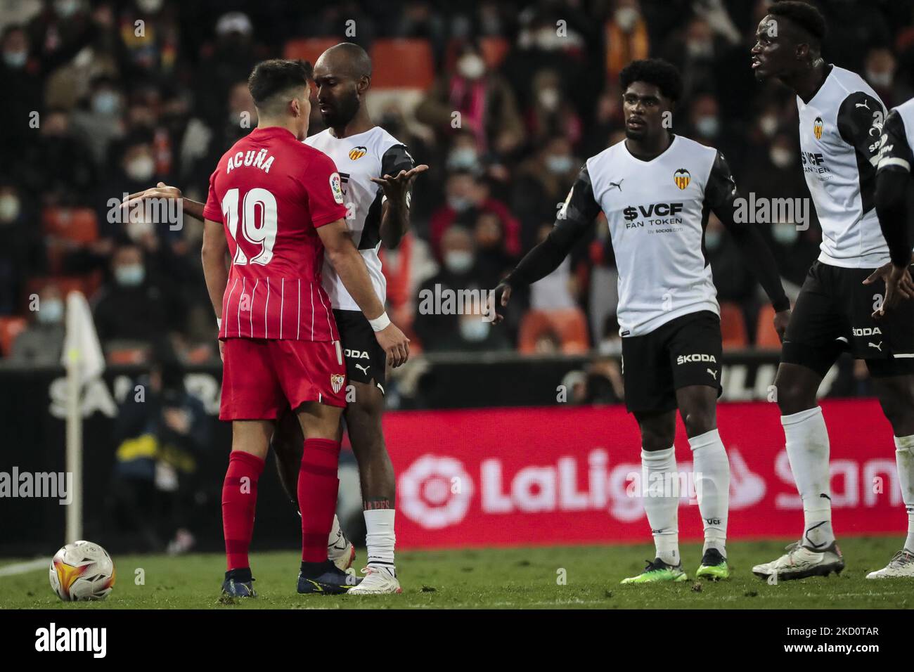 Marcos Javier Acuna of Sevilla FC (L) and Dimitri Foulquier of Valencia CF during La Liga match between Valencia CF and Sevilla CF at Mestalla Stadium on January 19, 2022. (Photo by Jose Miguel Fernandez/NurPhoto) Stock Photo