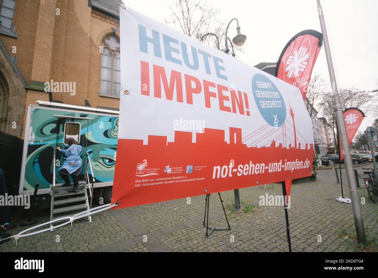 general view of mobile vaccination station in front of St. Maria Himmelfahrt church in Duesseldorf, Germany on January 19, 2022 as the number of omicron infections increasing rapidly in Germany (Photo by Ying Tang/NurPhoto) Stock Photo