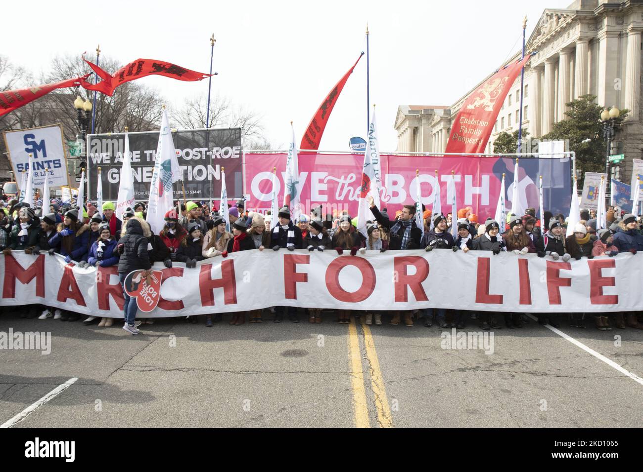 The lead banner in the March For Life took over Constitution Avenue sidewalk to sidewalk in downtown Washington, D.C. on Friday, January 21, 2022. The March for Life in D.C. is a nationwide event, where thousands of â€œpro-lifeâ€ supporters gather together to protest Roe v. Wade, the 1973 Supreme Court ruling that made abortion legal. The legal precedent, which has stood for decades, is under more scrutiny, as states like Texas and Mississippi pass more and more restrictive abortion laws. The Supreme Court has a conservative majority. (Photo by Zach Brien/NurPhoto) Stock Photo