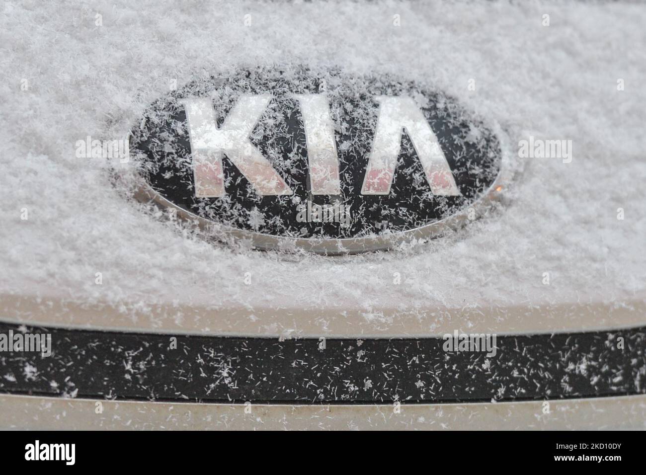 KIA logo seen on a Kia car covered with snow. On Friday, January 21, 2022, in Edmonton, Alberta, Canada. (Photo by Artur Widak/NurPhoto) Stock Photo