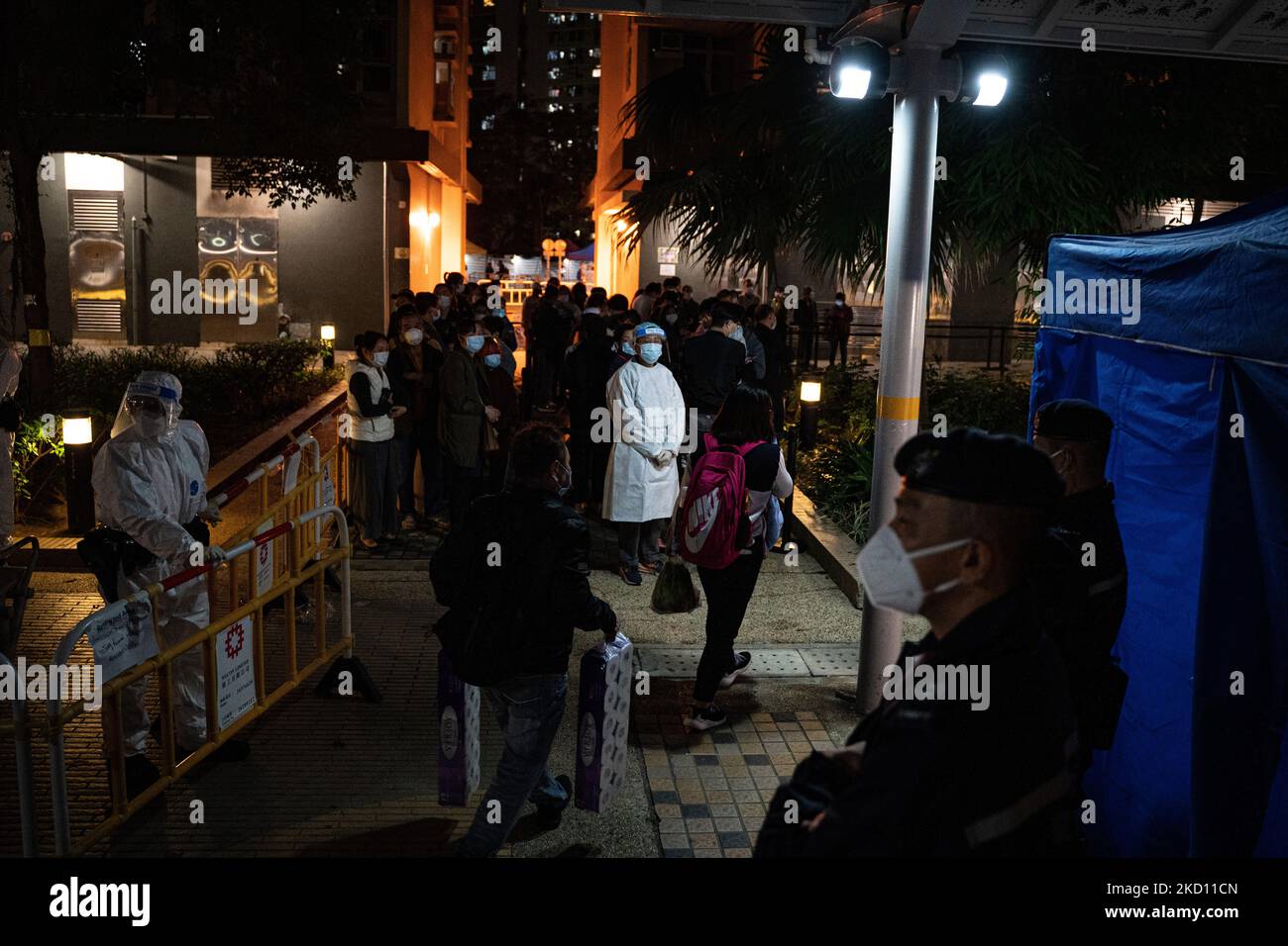 Citizens pass by with daily necessities outside a temporary Covid19 testing station outside a