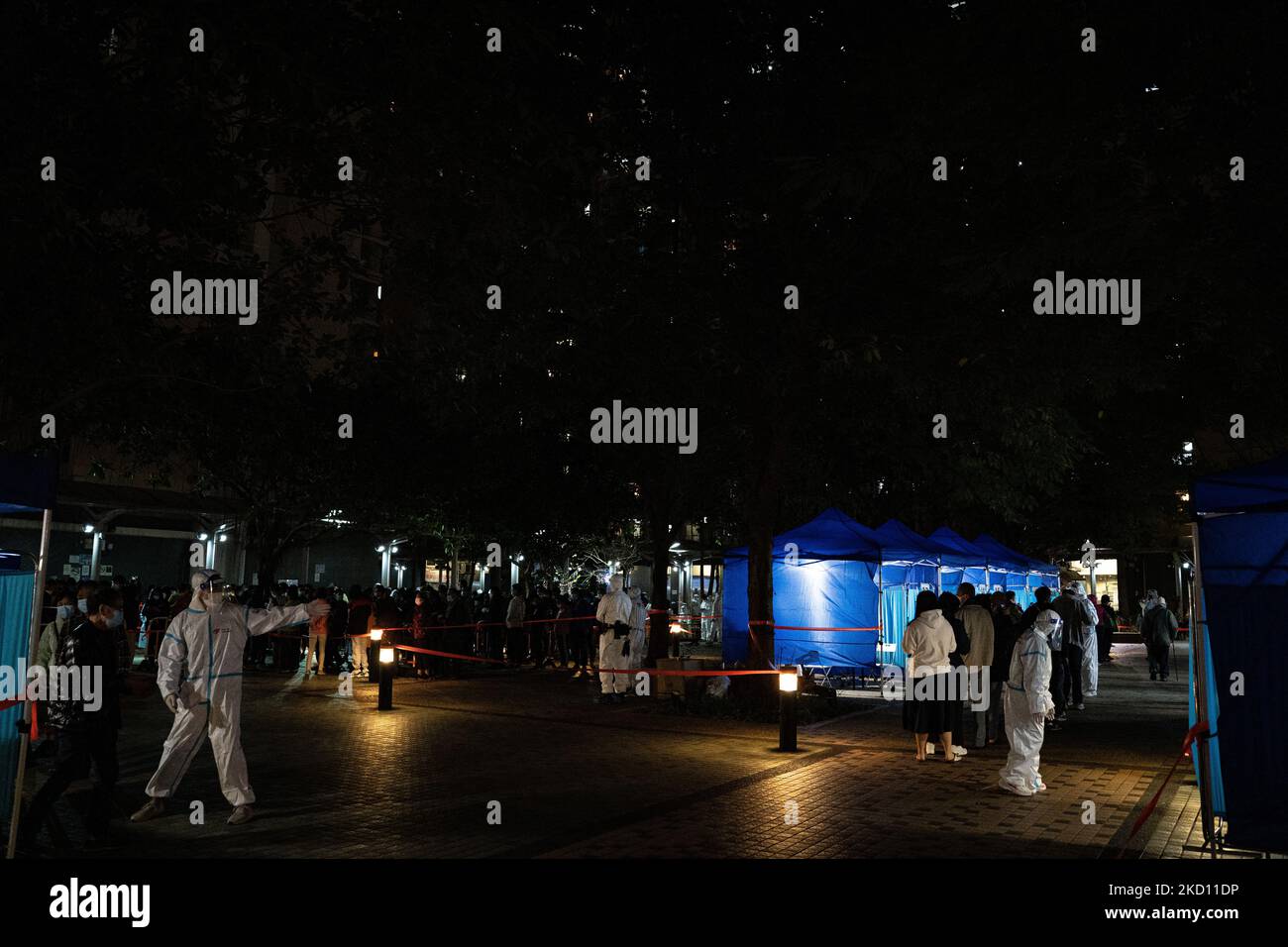 Residents wait in line for a makeshift Covid19 testing station outside the vacant lot of the