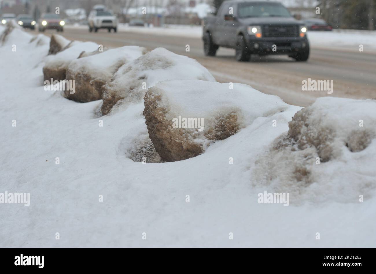 Snow and ice on the side on street in South Edmonton. on On Friday, January 21, 2021, in Edmonton, Alberta, Canada. (Photo by Artur Widak/NurPhoto) Stock Photo