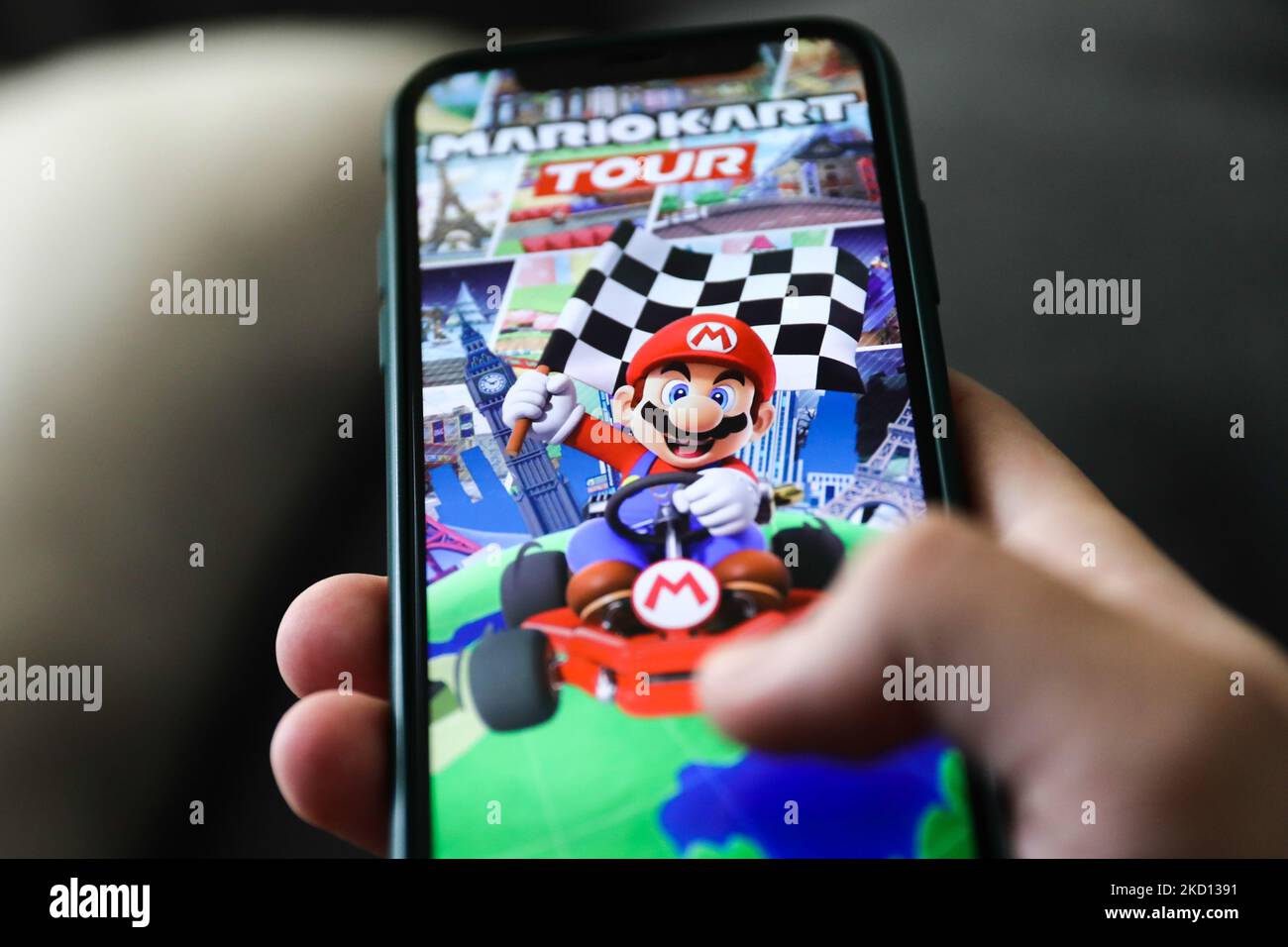 Mariokart Tour logo on the App Store displayed on a phone screen is seen in this illustration photo taken in Krakow, Poland on January 23, 2022. (Photo by Jakub Porzycki/NurPhoto) Stock Photo