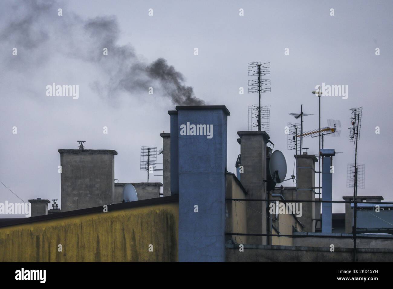 Dark smoke from a town house chimney during winter is seen in the center of Gliwice, Poland on January 24, 2022. Poland is one of the most polluted countries in the EU. Most of the air pollution across Poland is the result of the country's dependence oncoal to power its homes and economy. (Photo by Beata Zawrzel/NurPhoto) Stock Photo