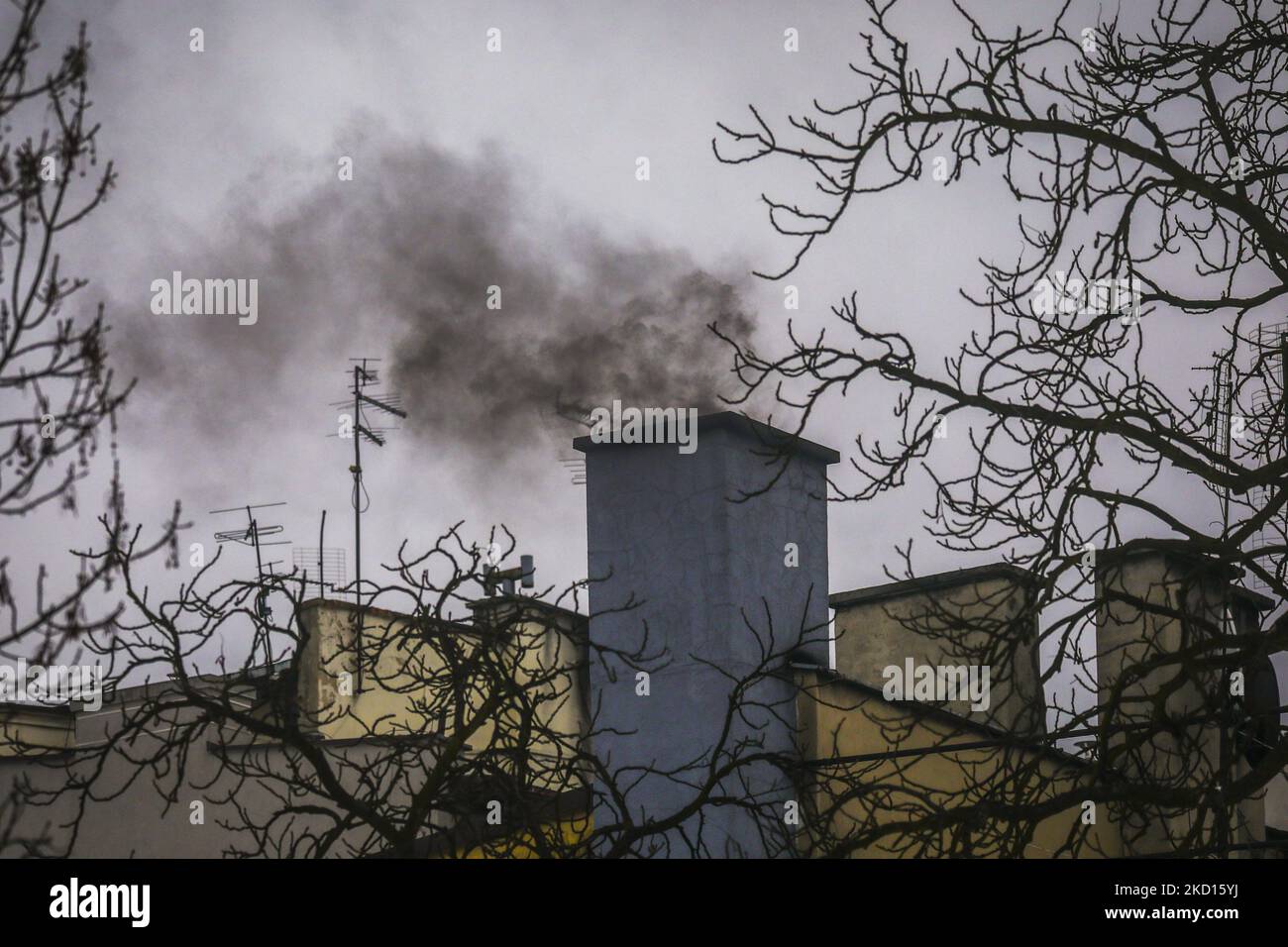 Dark smoke from a town house chimney during winter is seen in the center of Gliwice, Poland on January 24, 2022. Poland is one of the most polluted countries in the EU. Most of the air pollution across Poland is the result of the country's dependence oncoal to power its homes and economy. (Photo by Beata Zawrzel/NurPhoto) Stock Photo