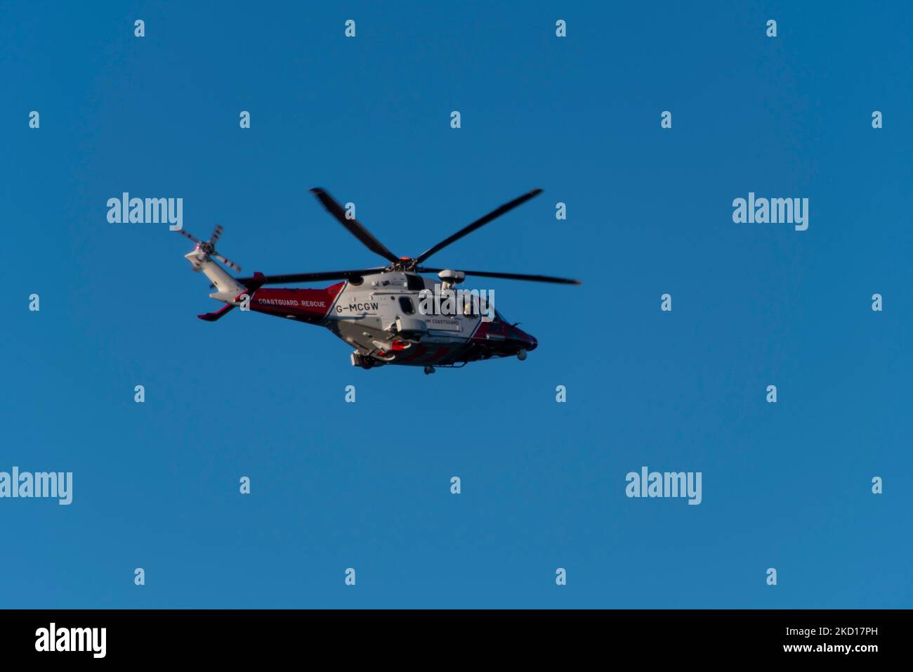 Coastguard Helicopter Doing A Low Flypast At Tenby, West Wales Stock 