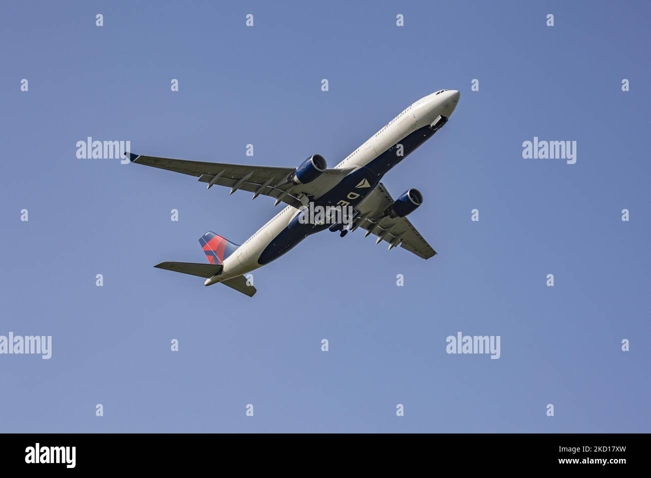 Delta Air Lines Airbus A330-300 aircraft as seen during take off and flying as it is departing from Amsterdam Schiphol International Airport AMS EHAM. The A330 wide body airplane has the registration N807NW. Delta is a legacy carrier, one of the major of the United States, the world's largest airline by passengers carried, member of SkyTeam aviation airline alliance. The aviation industry and passenger traffic are phasing a difficult period with the Covid-19 coronavirus pandemic having a negative impact on the travel business industry with fears of the deteriorating situation due to the new Om Stock Photo