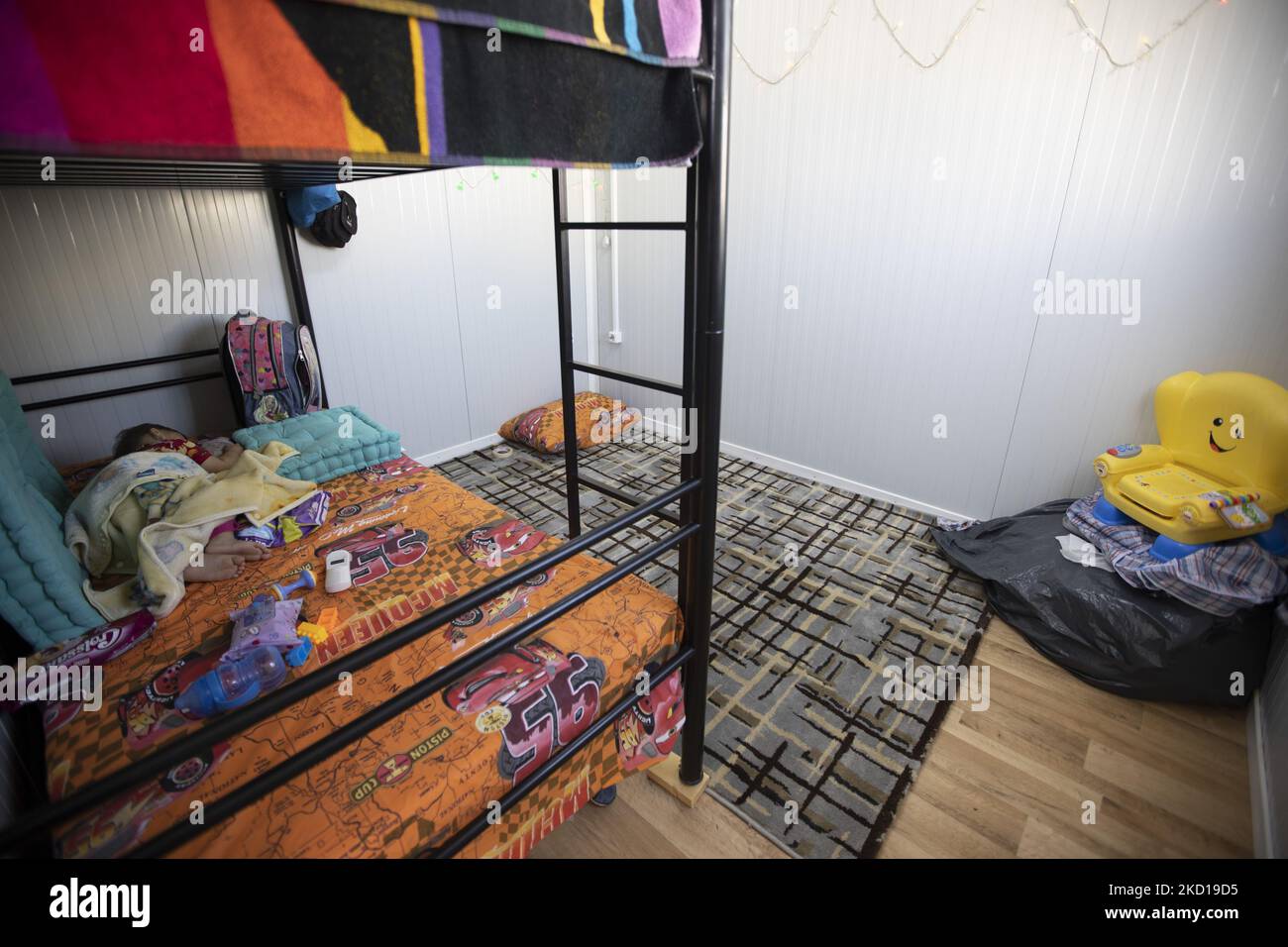 Inside the housing facility that host a family in the bedroom with bunk