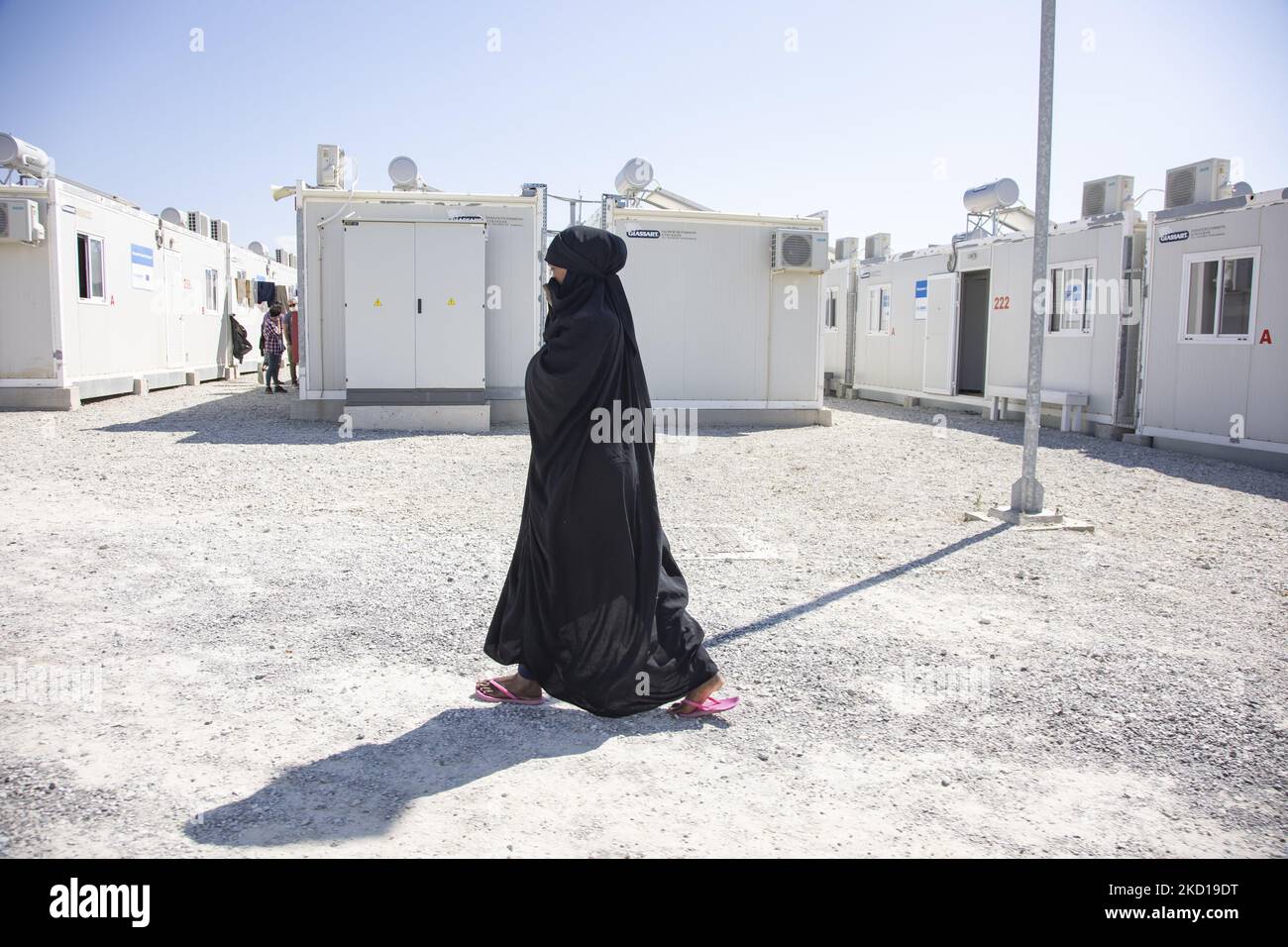 A young woman as seen walking in the camp wearing the traditional