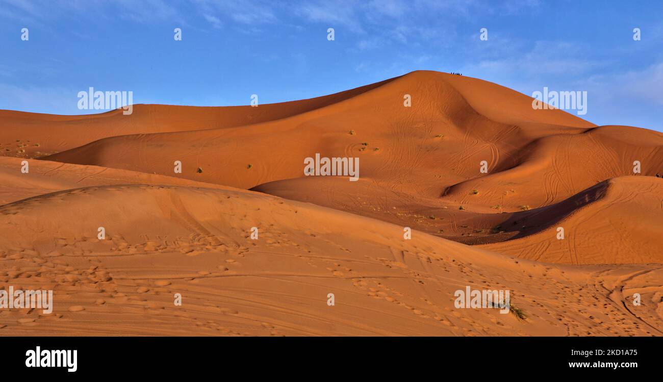 Sand dunes near the small village of Merzouga in Morocco, Africa. Merzouga is a village in the Sahara Desert in Morocco, on the edge of Erg Chebbi, a 50km long and 5km wide set of sand dunes that reach up to 350m. (Photo by Creative Touch Imaging Ltd./NurPhoto) Stock Photo