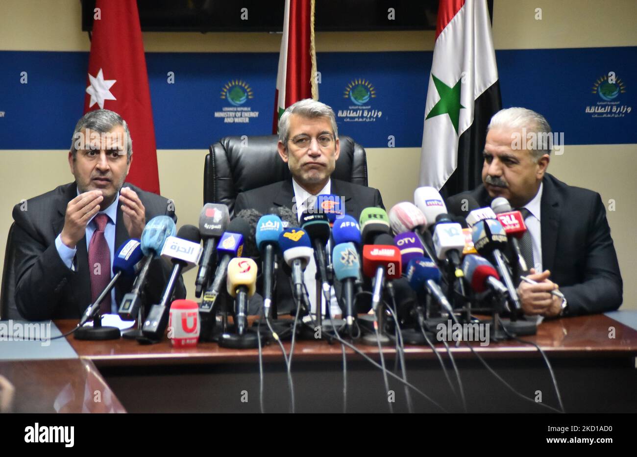 Lebanon's Energy Minister Walid Fayad (R), Syria's Electricity Minister Ghassan al-Zamil (2nd R) and Jordan's Minister of Energy and Mineral Resources Saleh Ali Hamed al-Kharabsheh (L) sit during the signing of a deal that will supply Lebanon with electricity, in Beirut on January 26, 2022. (Photo by Fadel Itani/NurPhoto) Stock Photo