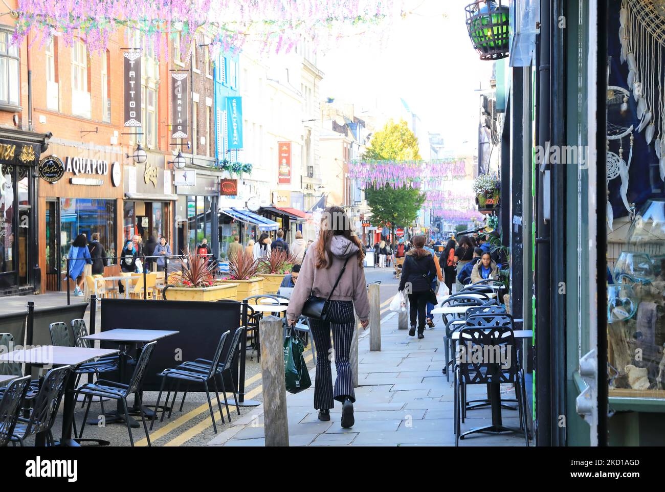Cobbled Bold Street in the Ropewalks area of central Liverpool, now full of independent shops, trendy cafes and multicultural restaurants, in autumn sunshine, UK Stock Photo