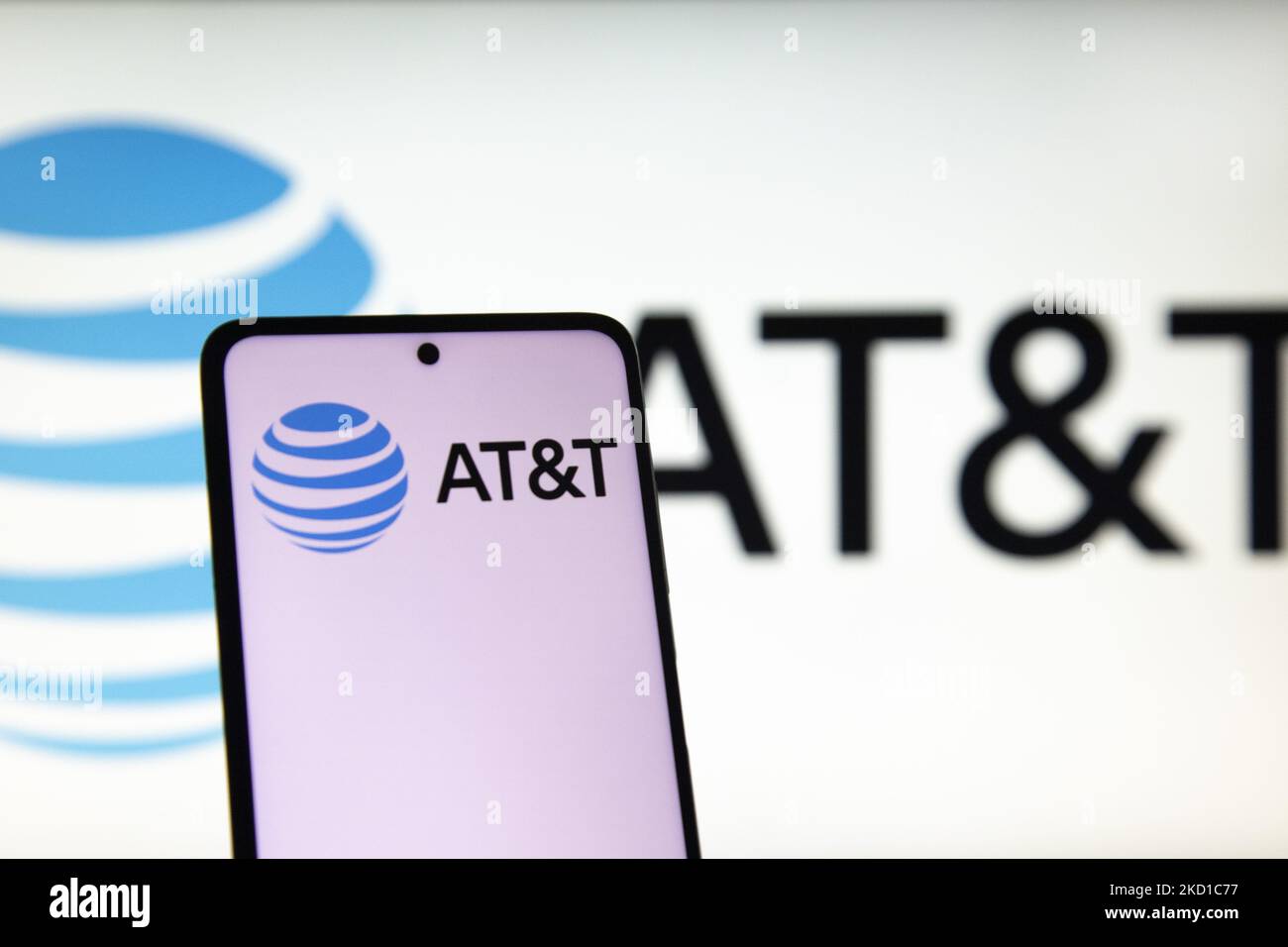 Photo illustration of AT&T symbol displayed on a mobile phone screen ...