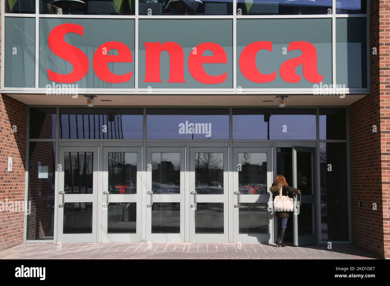 Student entering the Stephen E. Quinlan Building at the Seneca College campus at York University in Toronto, Canada. Several schools are located at this Toronto campus, including Creative Arts and Animation, Biological Sciences & Applied Chemistry, English and Liberal Studies and Information and Communications Technology. Seneca College of Applied Arts and Technology is a post-secondary educational institution in Toronto, Ontario offering programs at the baccalaureate, diploma, certificate and post-graduate levels. (Photo by Creative Touch Imaging Ltd./NurPhoto) Stock Photo
