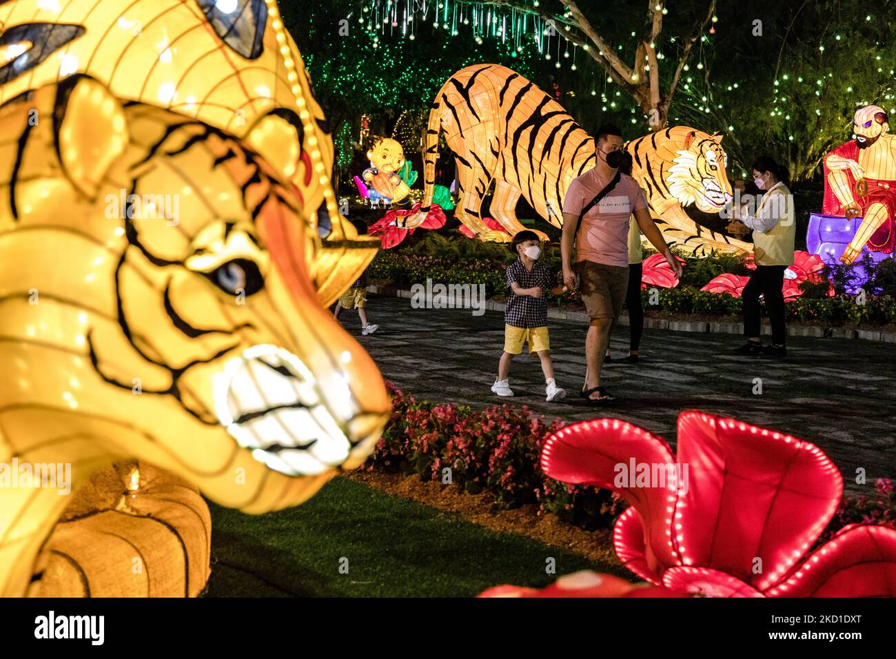People walk past the Chinese New Year decorations at the Fo Guang Shan Dong Zen Temple ahead of the upcoming Lunar New Year of the Tiger on January 28, 2022 in Jenjarom outside Kuala Lumpur, Malaysia. (Photo by Mohd Firdaus/NurPhoto) Stock Photo