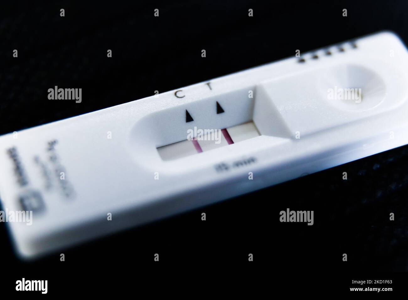 A positive result of rapid antigen test is seen in this illustration ...
